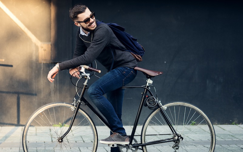 lifestyle image of a man on his bicycle